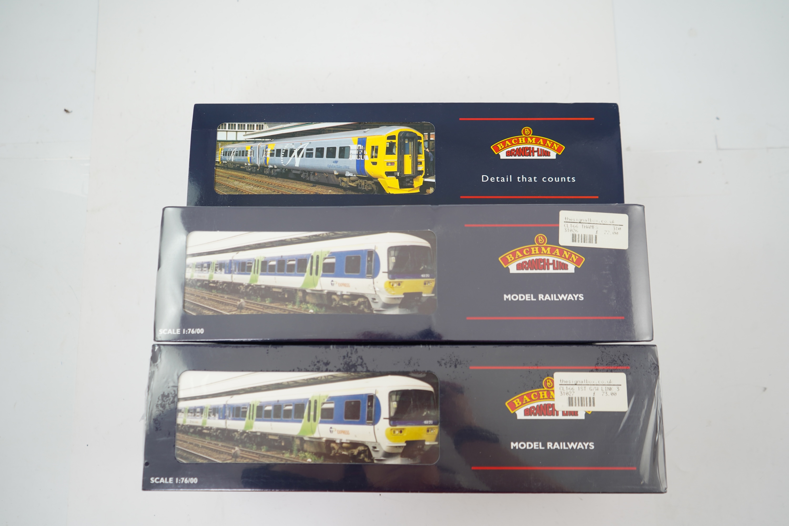 Three Bachmann Branchline 00 gauge railway DMU sets; 166 Turbo 3-car DMU, Thames Trains (31-026), 166 Turbo 3-car DMU, First Great Western/Link (31-027) and 158 2-car DMU, Wales and West (31-506)